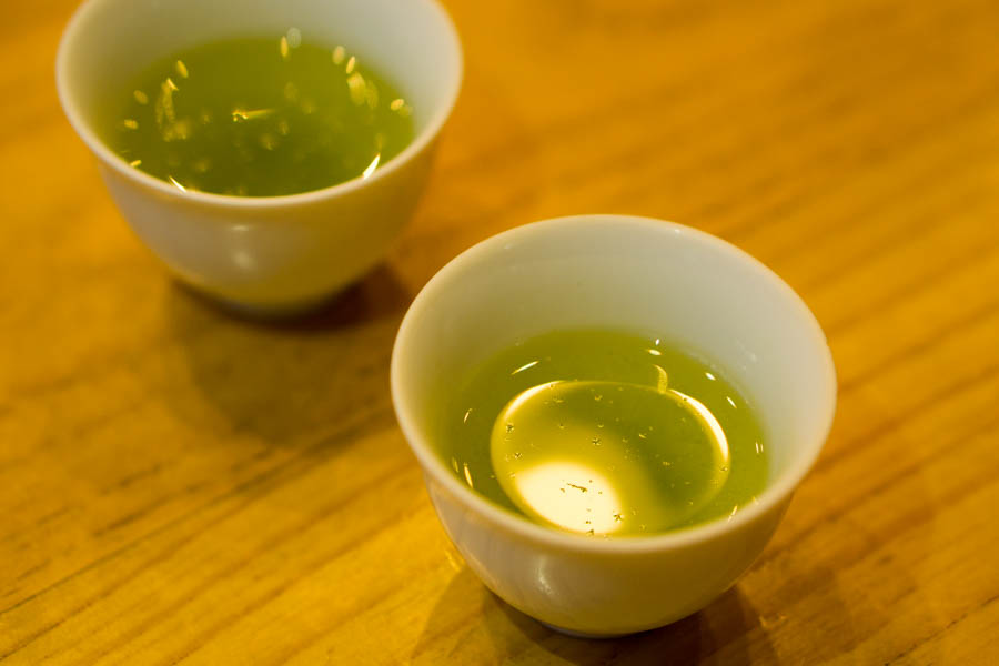 What looks dusts on the surface of green tea is...